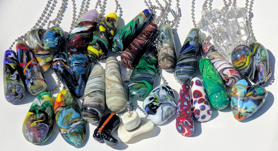 Ceiling fan pulls laid out in sunshine many differnt shapes